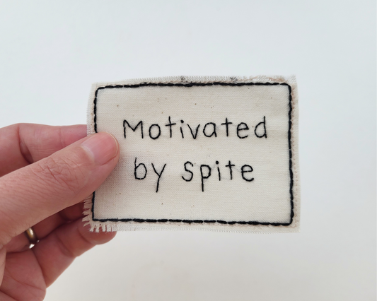 Hand embroidered patch - Motivated By Spite